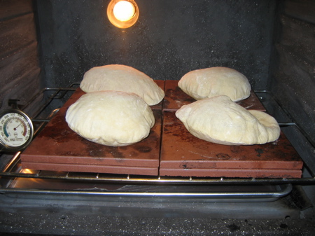 Four pita bread in the oven